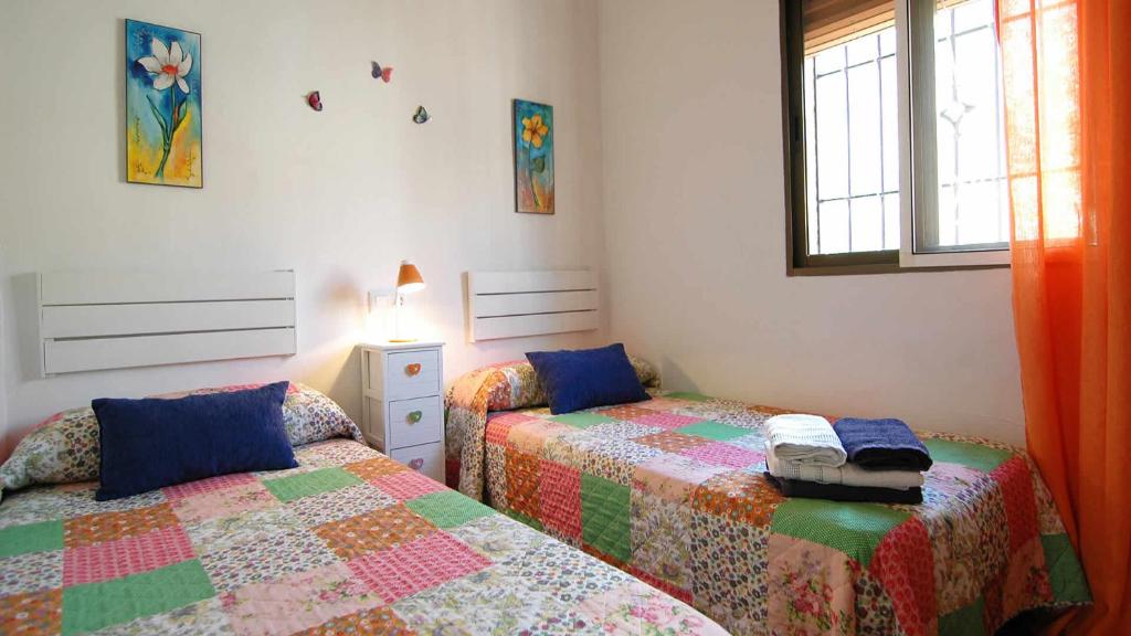 Posteľ alebo postele v izbe v ubytovaní Cortijo Mirador Casitas Select