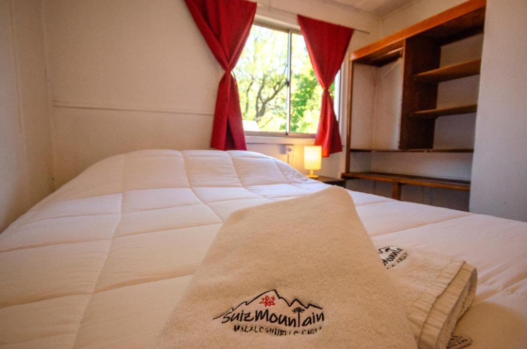 Voodi või voodid majutusasutuse SuizMountain toas