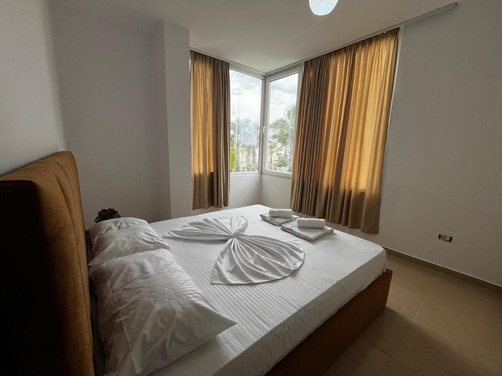 Ένα ή περισσότερα κρεβάτια σε δωμάτιο στο Cattleya Apartment