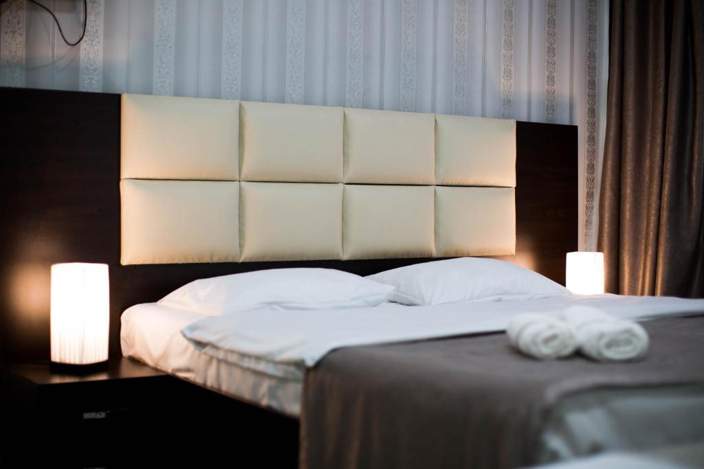 Postel nebo postele na pokoji v ubytování Hotel Care Inn