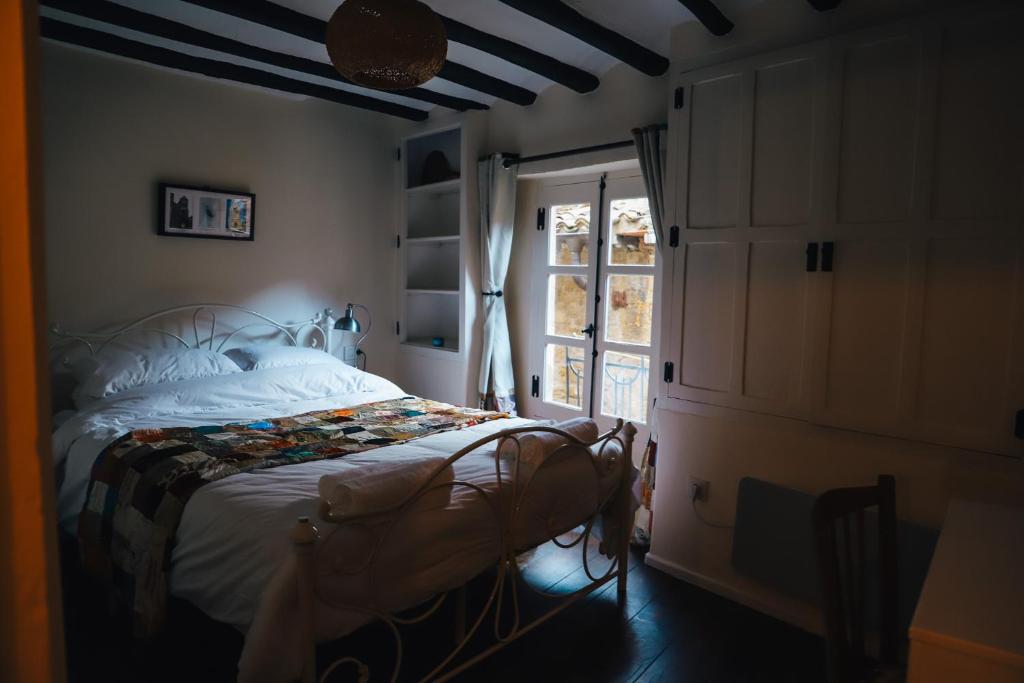 a bedroom with a bed and a window at Número 8 a Traditional Basque Village Homestead in Laguardia