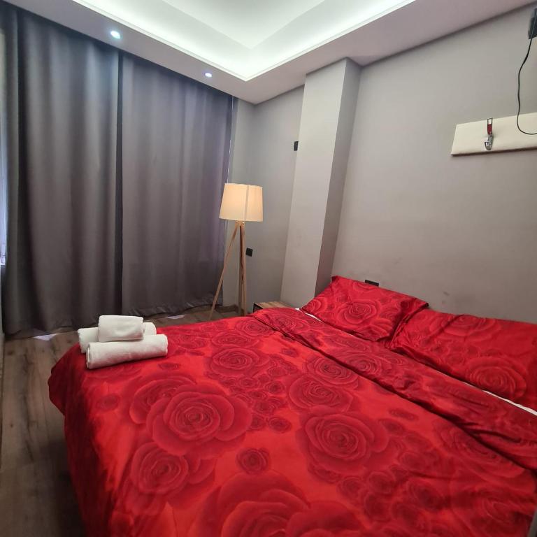 Postel nebo postele na pokoji v ubytování Driti Central Hotel