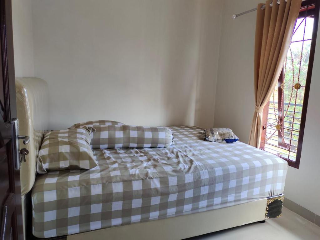 Postel nebo postele na pokoji v ubytování JM HOMESTAY