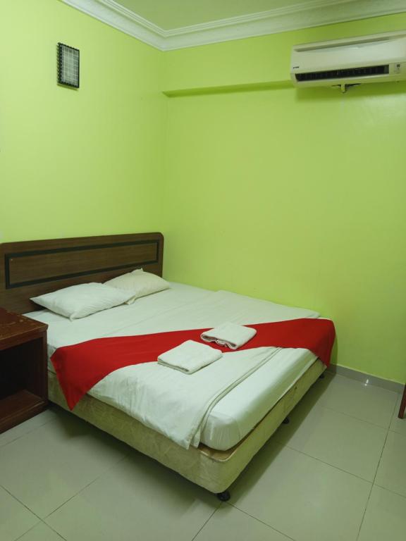 Postel nebo postele na pokoji v ubytování Hotel Dream Nur