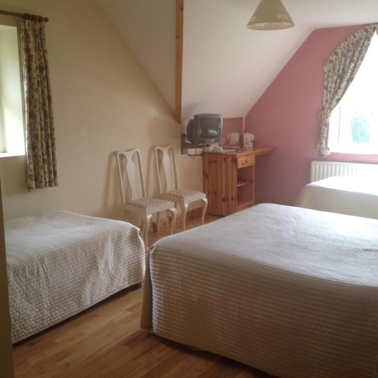 Voodi või voodid majutusasutuse Yeats Lodge toas