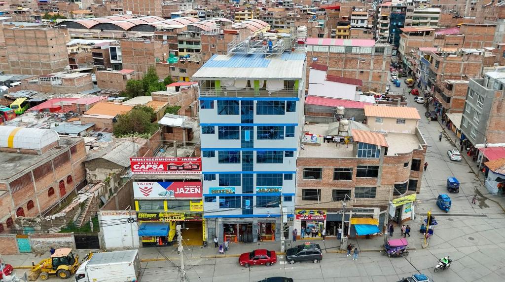 a blue building in the middle of a city at Hotel Jazen in Huaraz