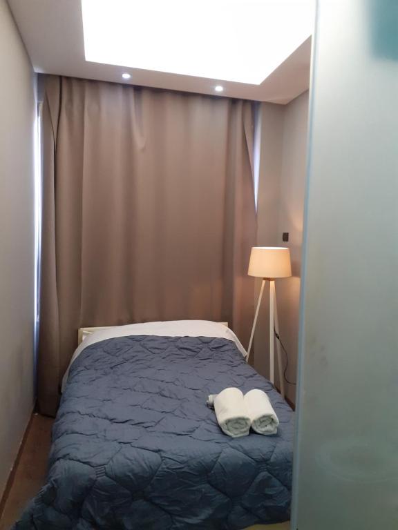 Postel nebo postele na pokoji v ubytování Driti Central Hotel
