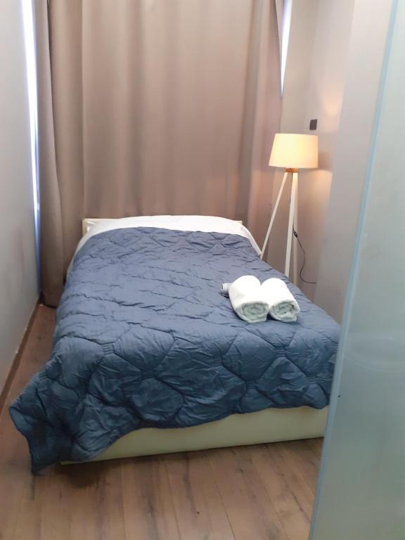 Postel nebo postele na pokoji v ubytování Driti Central Hotel