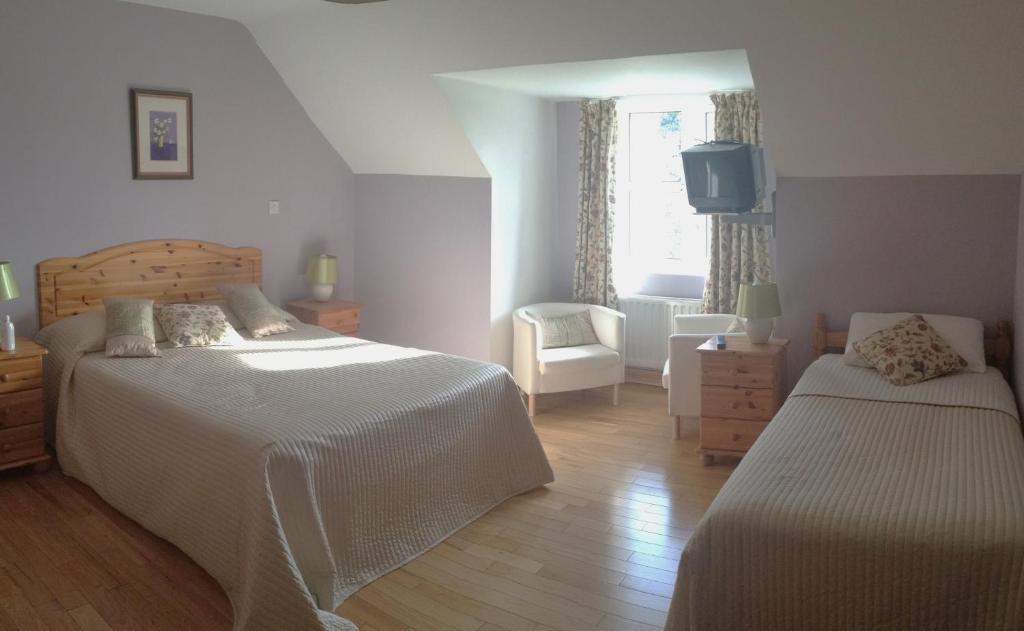 Voodi või voodid majutusasutuse Yeats Lodge toas