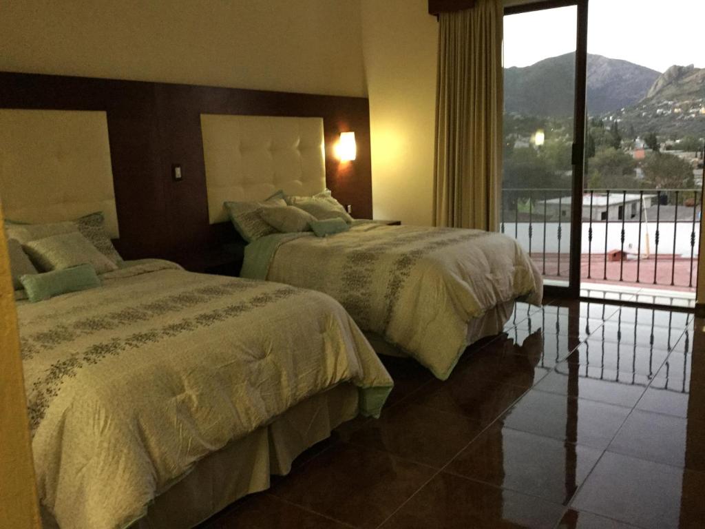Postel nebo postele na pokoji v ubytování Hotel Mariazel