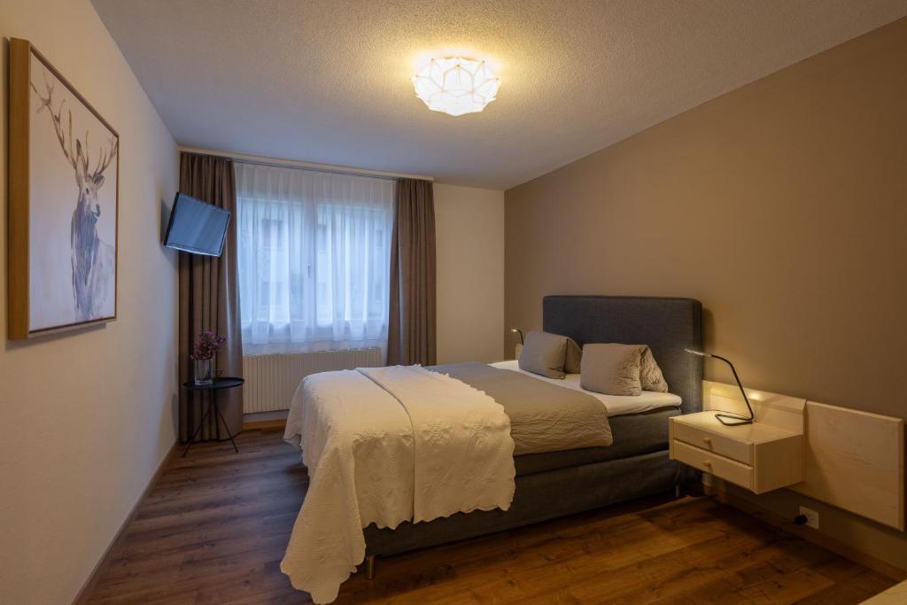 Postel nebo postele na pokoji v ubytování Hotel Alpina