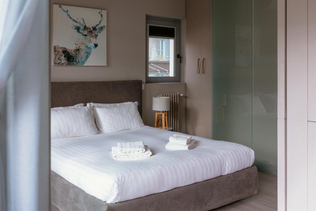 A bed or beds in a room at My Lovely Place Loreto