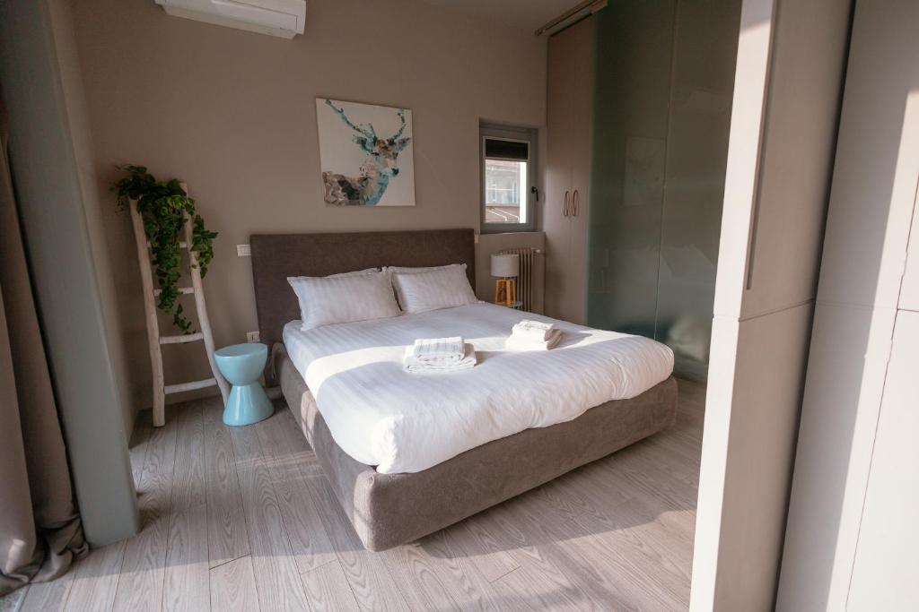 A bed or beds in a room at My Lovely Place Loreto