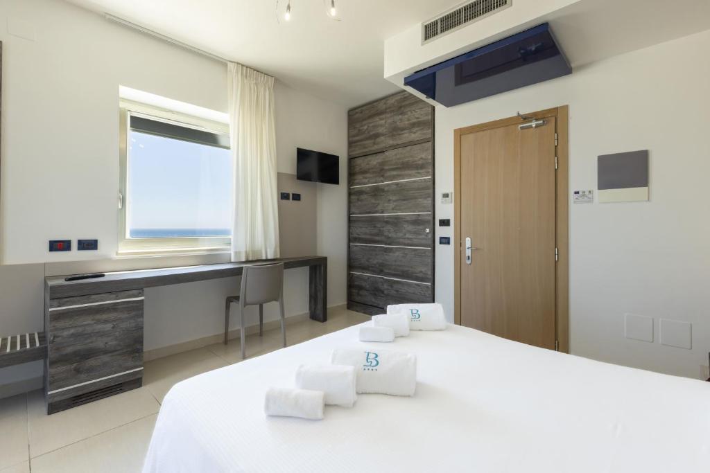 Кровать или кровати в номере Hotel Belvedere