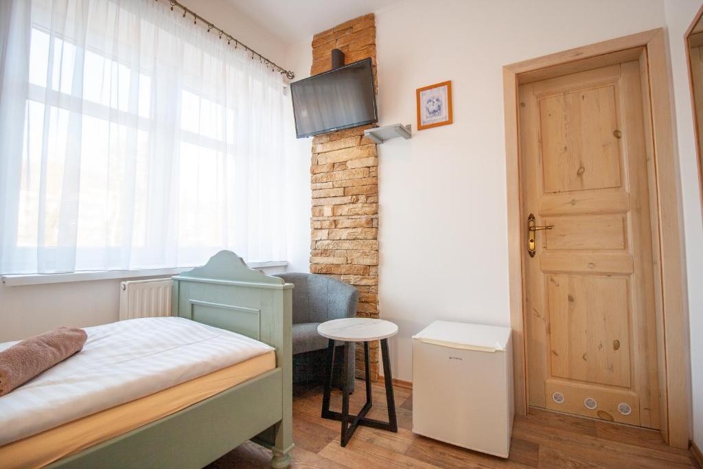 Postel nebo postele na pokoji v ubytování Penzion Anebel