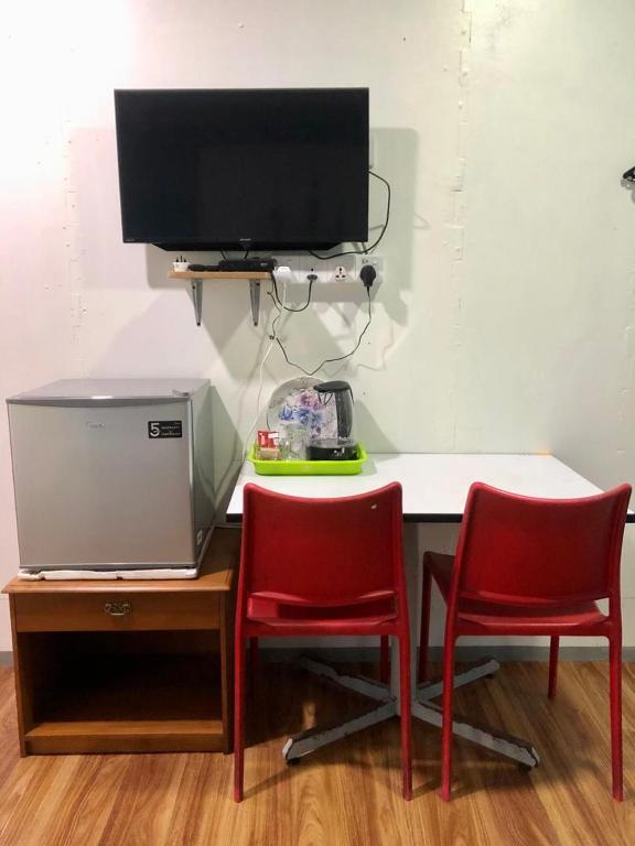 TV a/nebo společenská místnost v ubytování WAN'S ROOMSTAY LANGKAWI