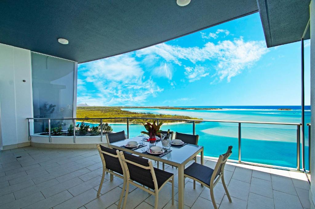 a dining room with a view of the ocean at Waves Maroochy River in Maroochydore