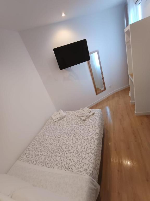Cama o camas de una habitación en Hostal Flat55Madrid