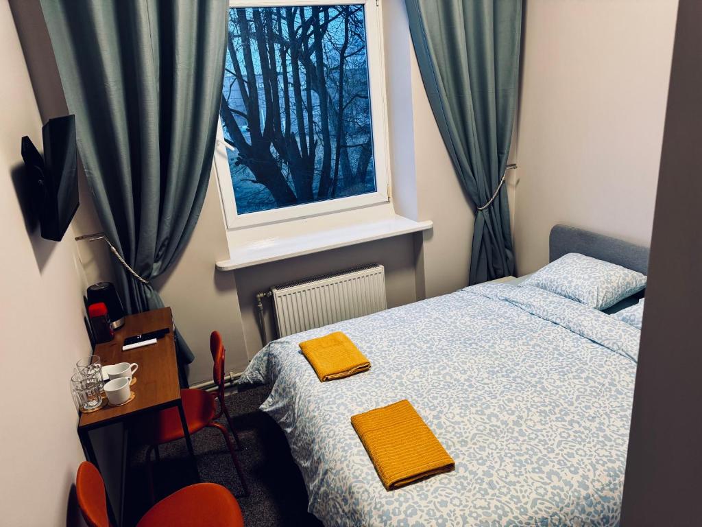 Postel nebo postele na pokoji v ubytování AJ Chocolate Vilnius
