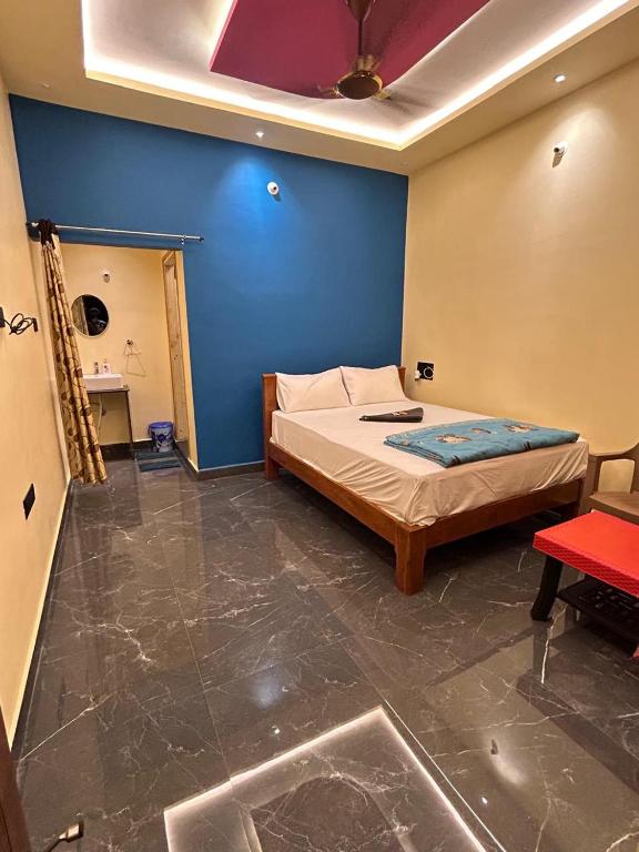 Voodi või voodid majutusasutuse MEENAKSHI GUEST Inn toas