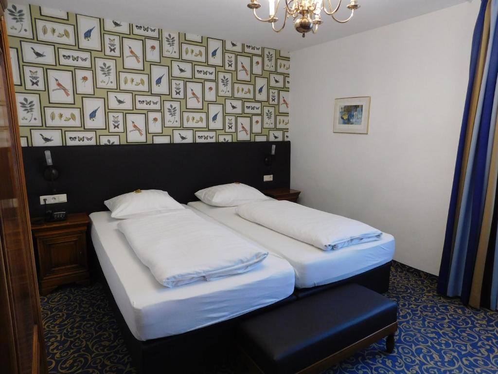 Postel nebo postele na pokoji v ubytování Hotel & Gasthaus Backmulde