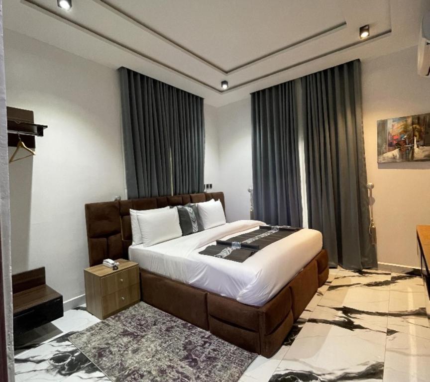 Postel nebo postele na pokoji v ubytování Lisa Suites Hotel