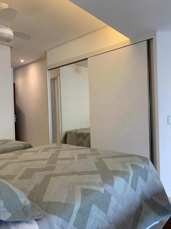 Postel nebo postele na pokoji v ubytování Bahia Flat 125 Apto Aconchegante