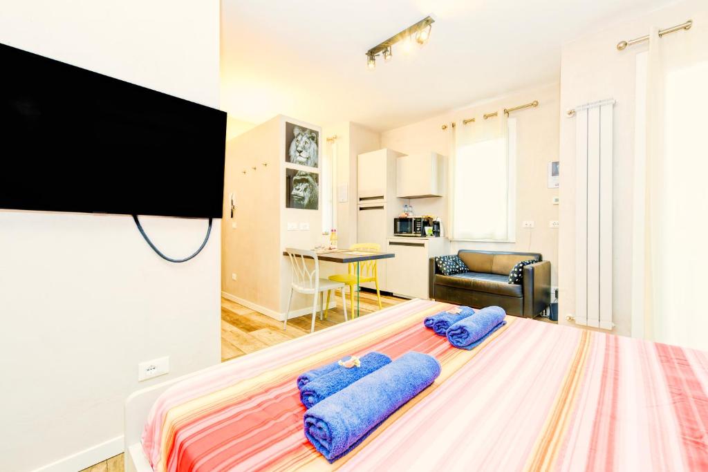 Televízia a/alebo spoločenská miestnosť v ubytovaní The Geko Apartment Sirmione