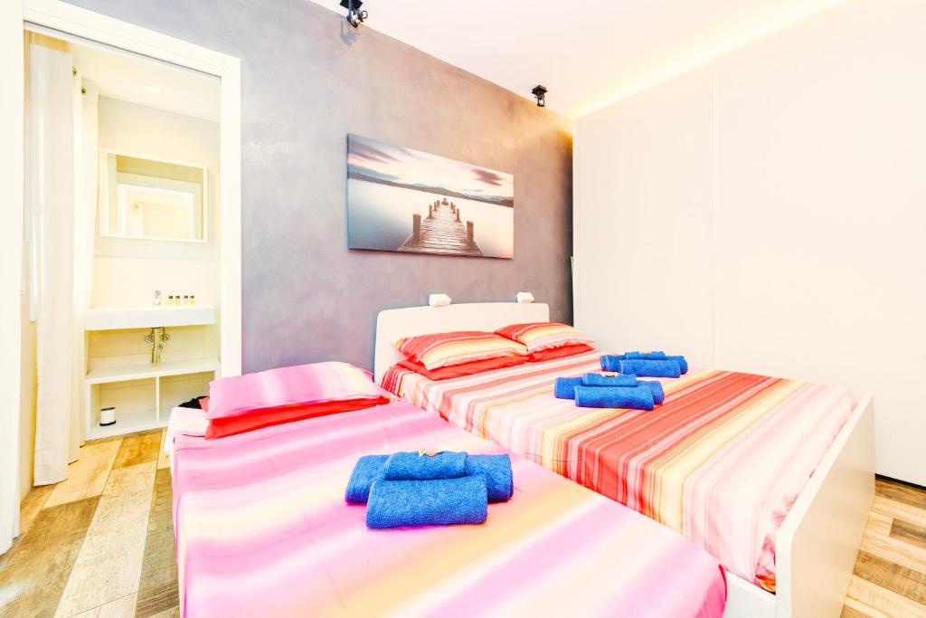 Posteľ alebo postele v izbe v ubytovaní The Geko Apartment Sirmione