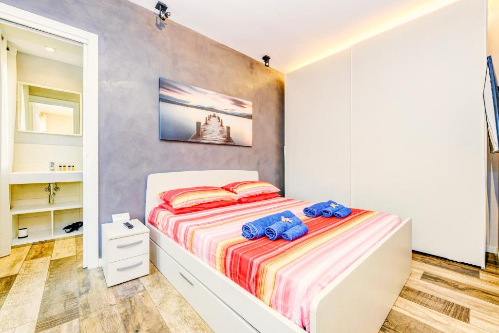 Posteľ alebo postele v izbe v ubytovaní The Geko Apartment Sirmione