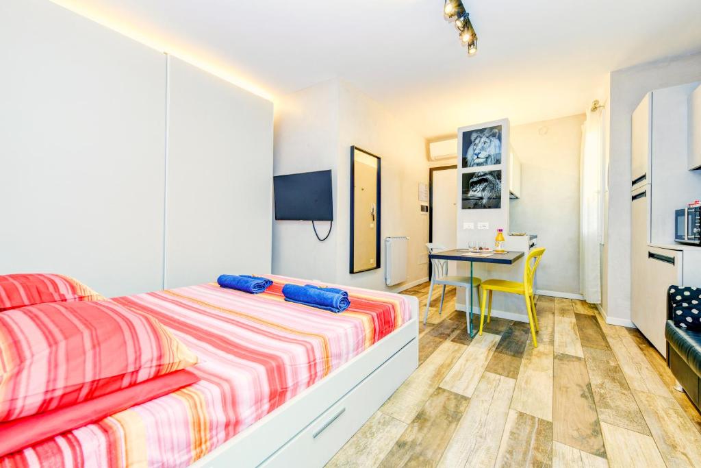 Posteľ alebo postele v izbe v ubytovaní The Geko Apartment Sirmione