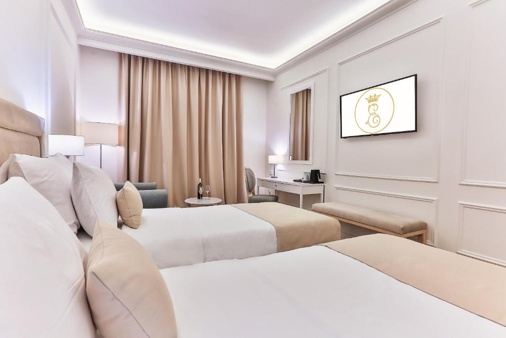 Postel nebo postele na pokoji v ubytování Hotel EDEN