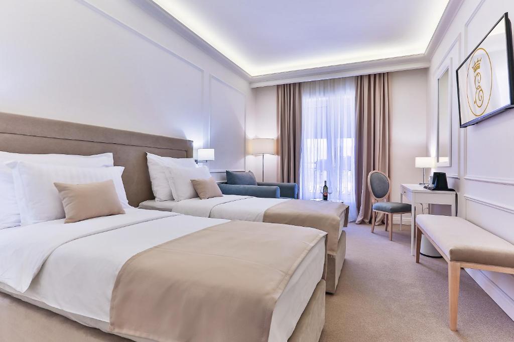 Postel nebo postele na pokoji v ubytování Hotel EDEN