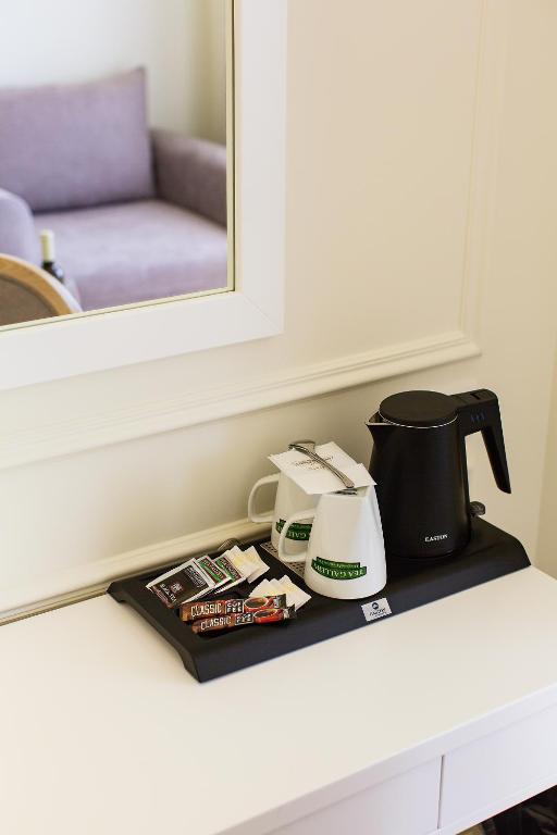 Příslušenství pro přípravu čaje a kávy v ubytování Hotel EDEN
