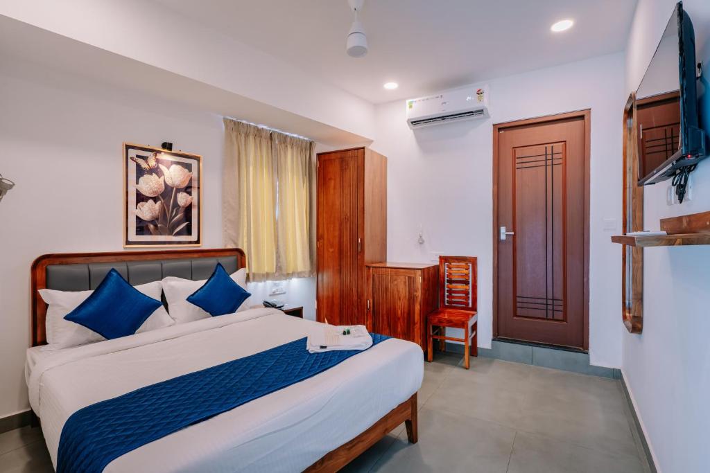 Postel nebo postele na pokoji v ubytování Urbn24 Business Class Hotel