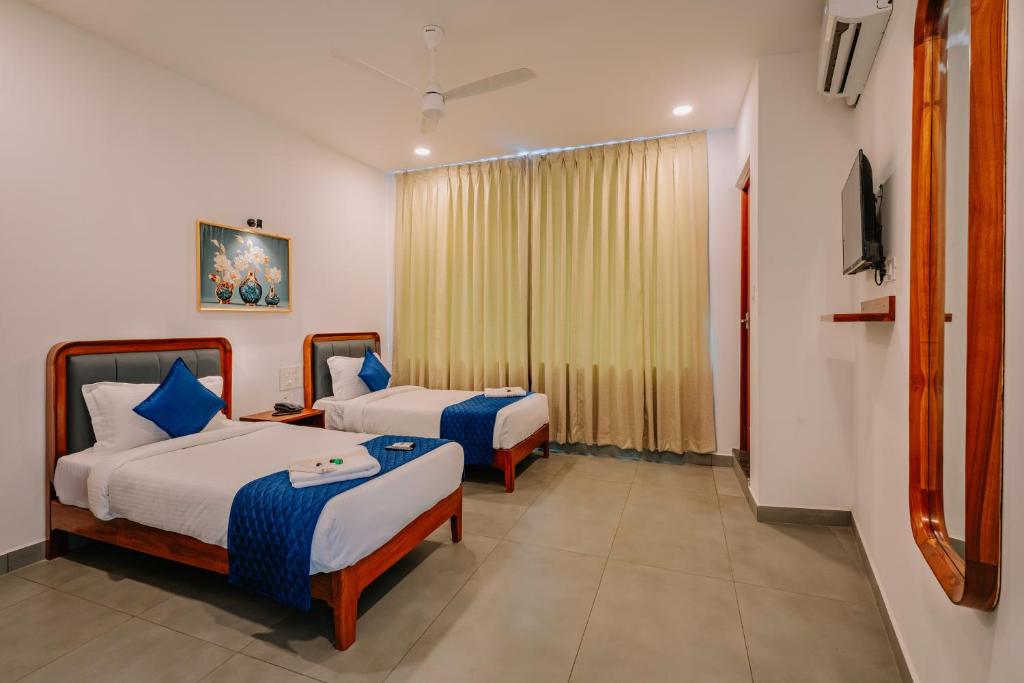 Postel nebo postele na pokoji v ubytování Urbn24 Business Class Hotel