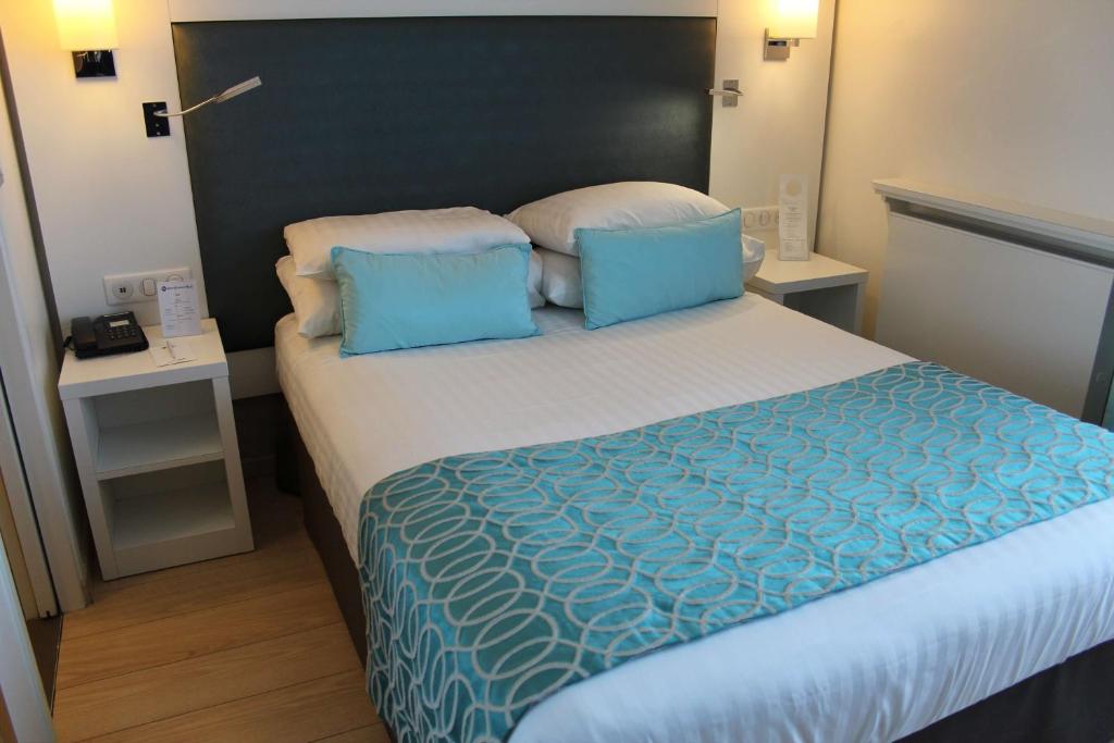 Postel nebo postele na pokoji v ubytování Best Western Plus Hotel Carlton Annecy