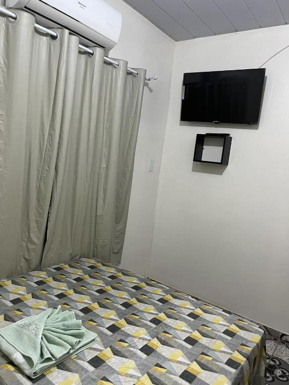 TV a/nebo společenská místnost v ubytování Pousada Irmãos Perrone