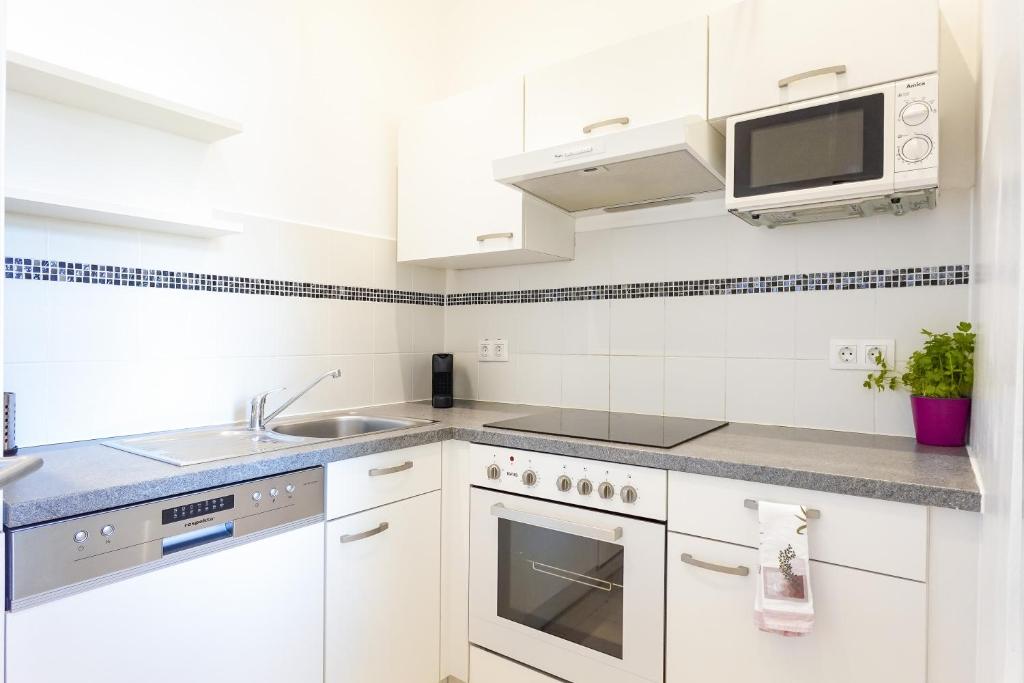 Kuchyňa alebo kuchynka v ubytovaní Appartements CHE