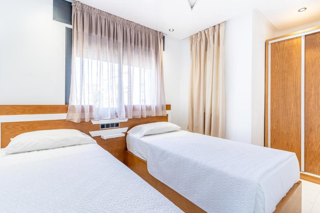 Postel nebo postele na pokoji v ubytování Hot appar Luxury SuiteMar