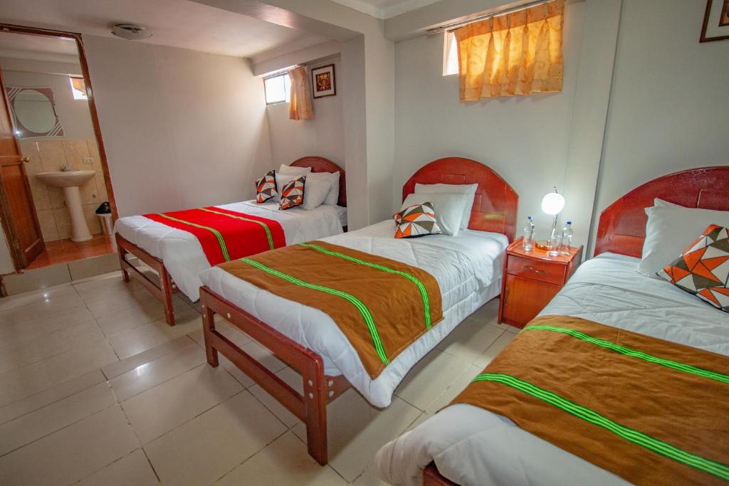 Postel nebo postele na pokoji v ubytování AloInkaHotels