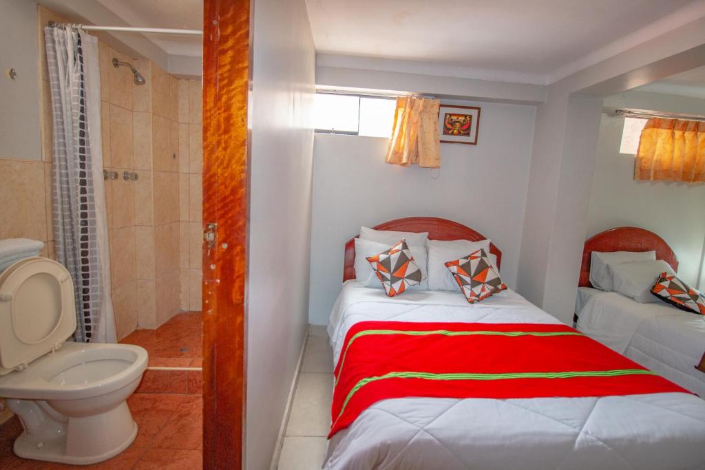 Postel nebo postele na pokoji v ubytování AloInkaHotels