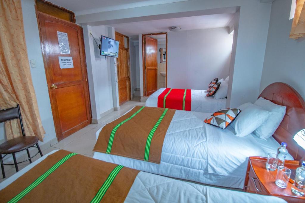 Postel nebo postele na pokoji v ubytování AloInkaHotels