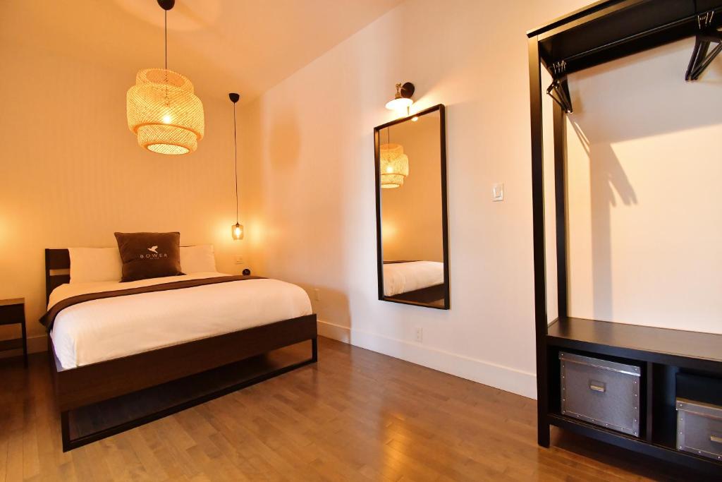 Postel nebo postele na pokoji v ubytování Maison Évangéline by Bower Boutique Hotels