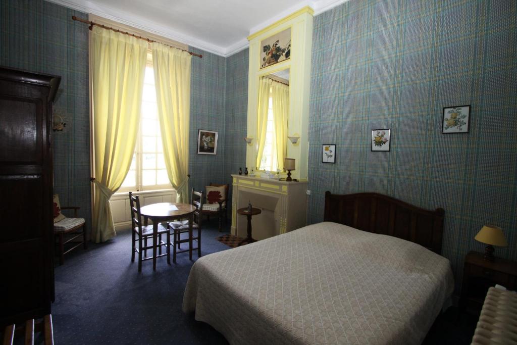 Postel nebo postele na pokoji v ubytování Chateau de Vouilly