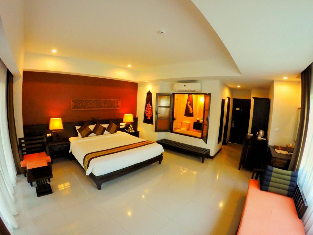 Postel nebo postele na pokoji v ubytování Navatara Phuket Resort