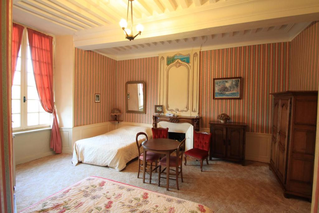 Postel nebo postele na pokoji v ubytování Chateau de Vouilly