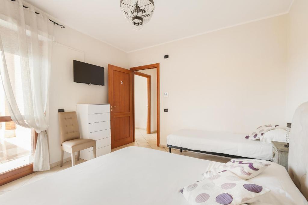 Postel nebo postele na pokoji v ubytování Giramondo Guest house