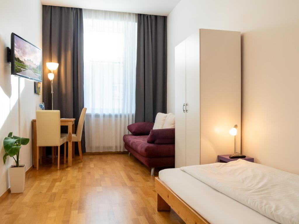 Posteľ alebo postele v izbe v ubytovaní Appartements CHE