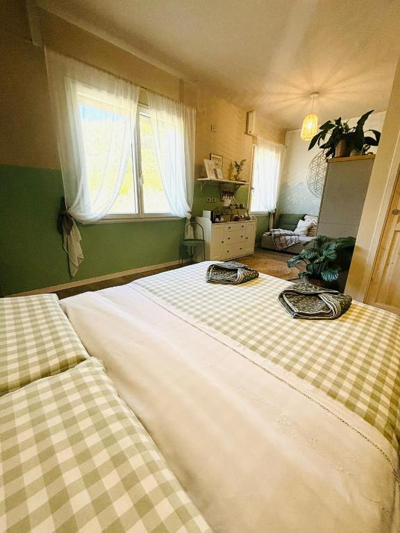 Postel nebo postele na pokoji v ubytování Amagi Home
